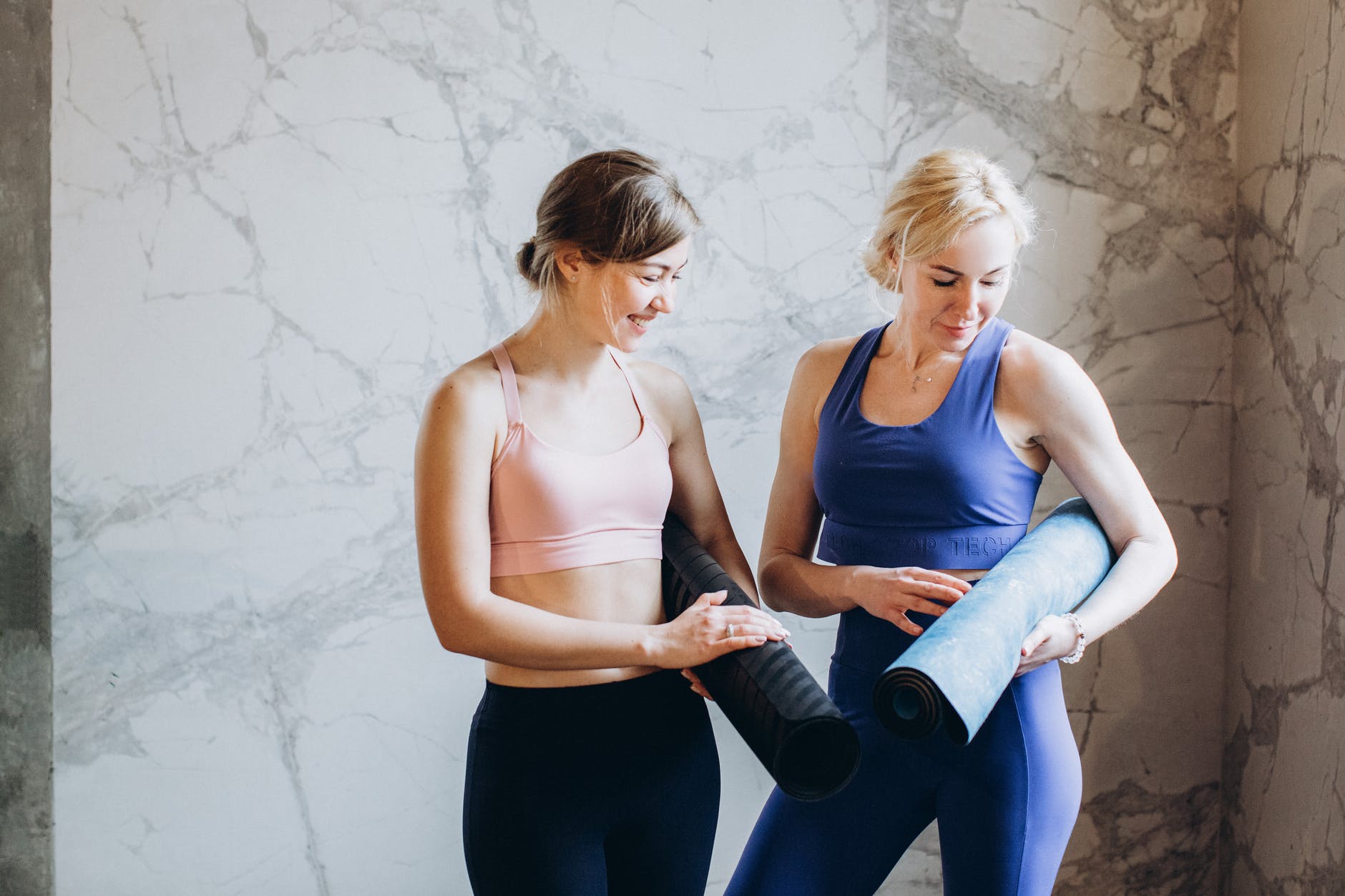 women comparing yoga mats